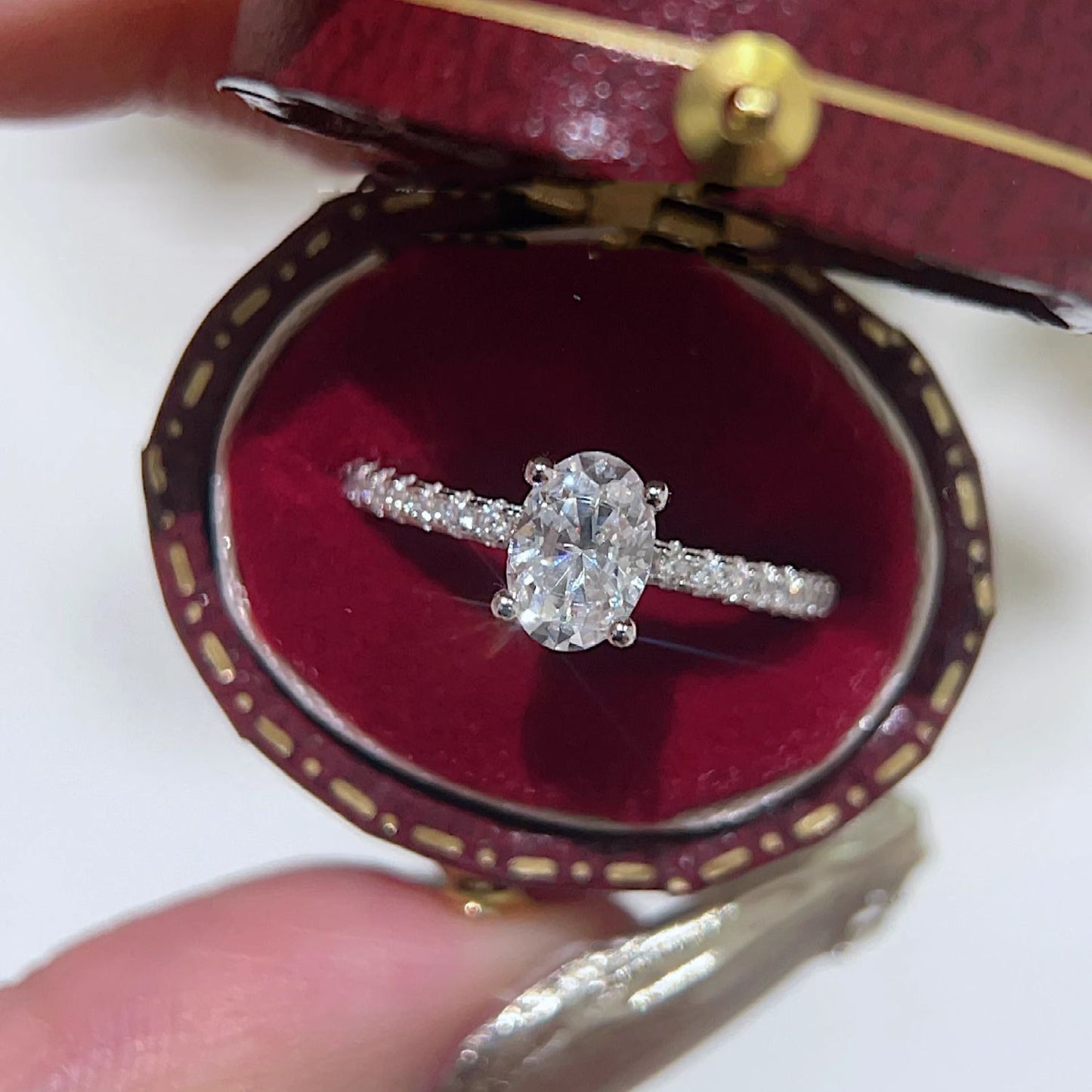 Oval paved moissanite ring