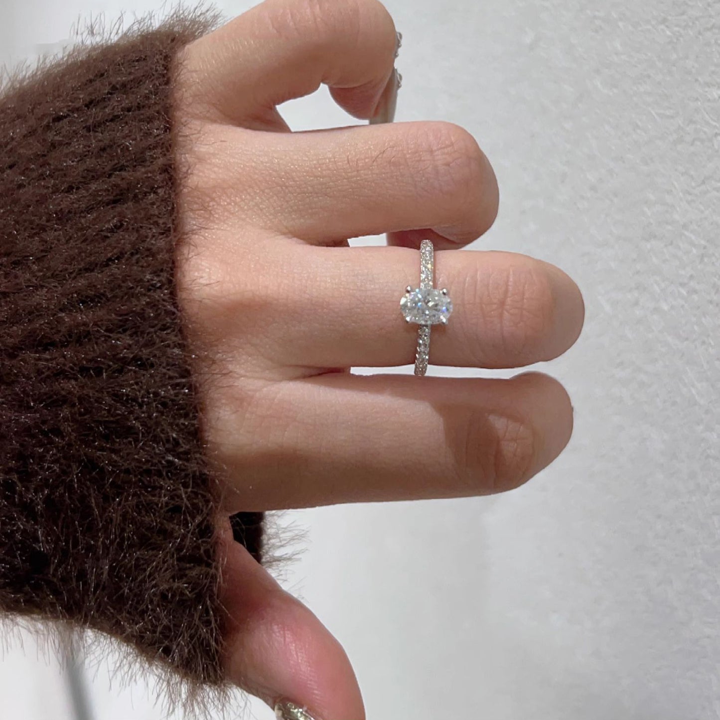 Oval paved moissanite ring