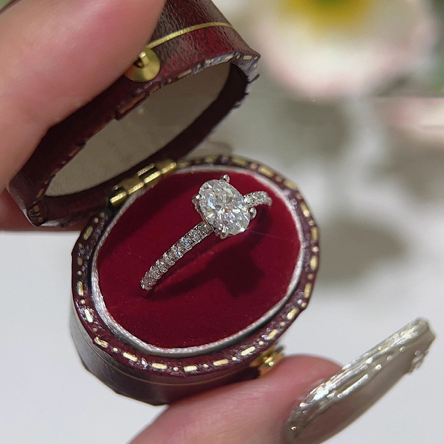 Oval paved moissanite ring